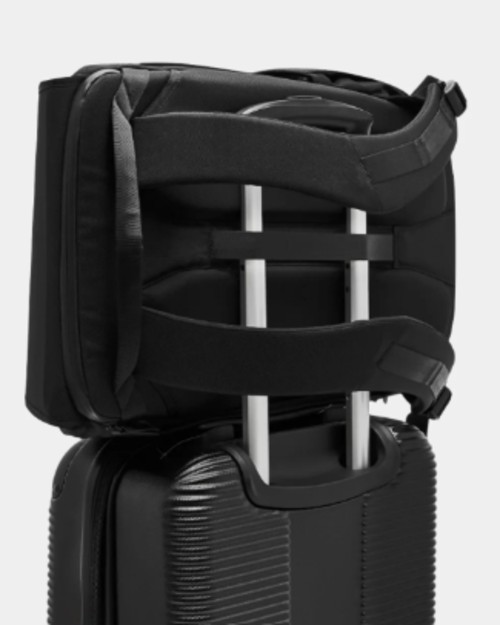 A backpack with a trolley sleeve attached to a suitcase